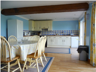 Kitchen-dining room with french doors leading to patio