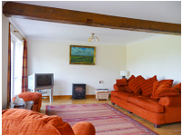 Large sitting room with french doors leading to patio